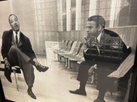 Martin Luther King and Andrew Young waiting at an airport